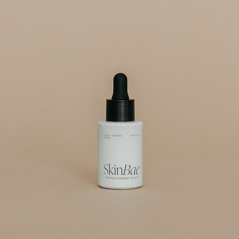 Skincare dropper bottle with 'SkinBar' branding on a beige background
